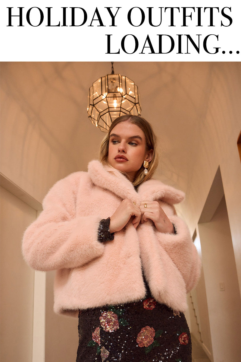 Woman in the Saltwater Luxe pink Silvia Jacket with text 'Holiday Outfits Loading...' in the center
