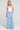 A full body front view of a woman wearing the Saltwater Luxe on a neutral background