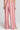 Back view of a woman wearing the Saltwater Luxe Adair Pant in Coffee on a neutral background
