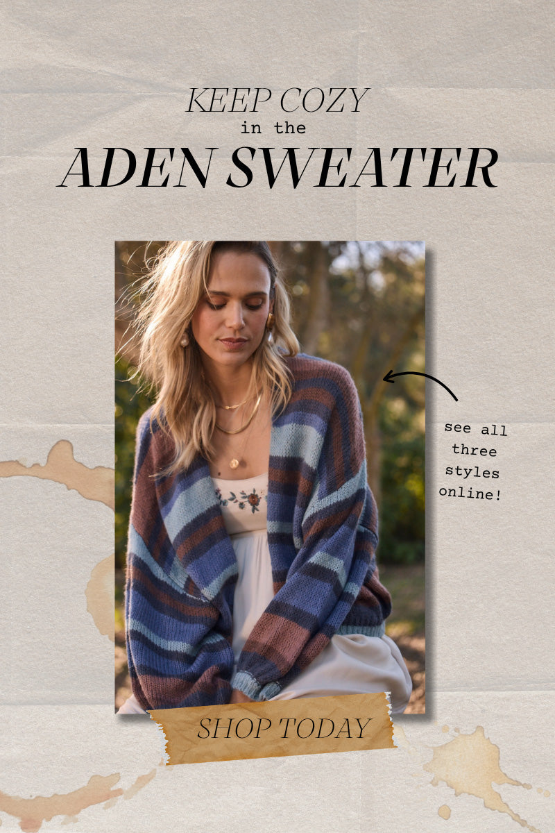 Saltwater Luxe Aden Sweater in a multicolor stripe layered over a floral dress for an effortless cozy fall look