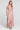 A full body front view of a woman wearing the Saltwater Luxe Amarra Multicolored Top on a neutral background