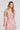 Front view of a woman wearing the Saltwater Luxe Amarra Multicolored Top on a neutral background