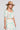 Side angle view of a woman wearing the Saltwater Luxe Amarra Pearl Top  on a neutral background