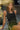 Front view of a woman wearing the Saltwater Luxe Ardenn Black Tank seated in a garden