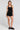 A full body front view of a woman wearing the Saltwater Luxe Ardenn Black Tank on a neutral background