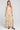 Front view of a woman wearing the Saltwater Luxe  Arosa Midi Dress in Fawn on a neutral background