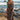 Front view of a woman wearing the Saltwater Luxe Avalan Midi Dress in Black in front of tide pools 
