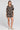 Full body front view of a woman wearing the Saltwater Luxe Berlyn Short in Black on a neutral background
