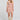 Front view of a woman wearing the Saltwater Luxe Bette Mini Dress in Natural on a neutral background