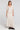 Full body front view of a woman wearing the Saltwater Luxe  Beverley Midi Skirt on a neutral background