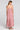 Back view of a woman wearing the Saltwater Luxe Bryent Midi Dress in Coffee on a neutral background