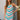 Front view of a woman wearing the Saltwater Luxe Camdyn Mini Dress in front of a house