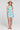 Front view of a woman wearing the Saltwater Luxe Camdyn Mini Dress on a neutral background