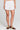 Front view of a woman wearing the Saltwater Luxe Celestia Short on a neutral background