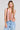 Front view of a woman wearing the Saltwater Luxe Chelsee Natural Top on a neutral background