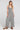 front view of a woman wearing the Saltwater Luxe Dorit Jumper on a neutral background