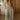 front view of a woman wearing the Saltwater Luxe Dorit Jumper in a kitchen
