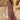 Front view of a woman wearing the Saltwater Luxe Evra Maxi Dress on a sandy beach