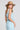 Back view of a woman wearing the Saltwater Luxe aelle Tank in Azure Blue on a neutral background
