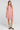 Front view of a woman wearing the Saltwater Luxe Genneva Mini Dress in Coffee on a neutral background