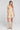 Front view of a woman wearing the Saltwater Luxe Gracee Mini Dress in Fawn on a neutral background