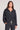 Front view of a woman wearing the Saltwater Luxe Half Zip Black Seam Pullover on a neutral background