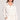 Front view of a woman wearing the Saltwater Luxe  Half Zip Ecru Seam Pullover on a neutral background