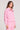Side angle view of a woman wearing the Saltwater Luxe Half Zip Petunia Seam Pullover on a neutral background