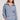 Front view of a woman wearing the Saltwater Luxe Half Zip Worn Blue Seam Pullover on a neutral background