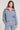 Front view of a woman wearing the Saltwater Luxe Half Zip Worn Blue Seam Pullover on a neutral background