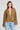 Front view of a woman wearing the Saltwater Luxe Havenn Fawn Sweater on a neutral background