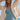 Font view of a woman wearing the Saltwater Luxe Havenn Natural Sweater on the beach