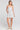 Front view of a woman wearing the Saltwater Luxe Jazmyn Mini Dress on a neutral background
