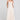 Front view of a woman wearing the Saltwater Luxe Kenzlie Dress on a neutral background