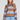 Front view of a woman wearing the Saltwater Luxe Kirra Dusty Blue Sweater on a neutral background