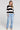 A full body front view of a woman wearing the Saltwater Luxe  Kirra Natural Sweater  on a neutral background