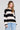 Front view of a woman wearing the Saltwater Luxe  Kirra Natural Sweater  on a neutral background