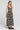 Front view of a woman wearing the Saltwater Luxe Kymber Midi Dress in Black on a neutral background