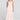 Front view of a woman wearing the Saltwater Luxe Laken Midi Dress in Camelia on a neutral background
