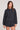 Front view of a woman wearing the Saltwater Luxe  Long Sleeve Black Pullover on a neutral background