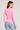 Back view of a woman wearing the Saltwater Luxe Long Sleeve Petunia Cardigan on a neutral background