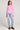 Full body front view of a woman wearing the Saltwater Luxe Long Sleeve Petunia Cardigan on a neutral background