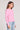 Side angle view of a woman wearing the Saltwater Luxe Long Sleeve Petunia Cardigan on a neutral background