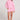 Full body front view of a woman wearing the Saltwater Luxe Long Sleeve Petunia Pullover on a neutral background
