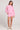 Full body front view of a woman wearing the Saltwater Luxe Long Sleeve Petunia Pullover on a neutral background