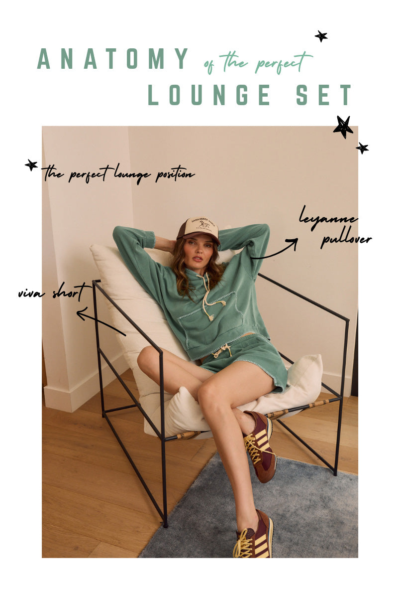 Woman sitting on a chair wearing a green sweater and shorts with text overlay about a 'perfect lounge set'
