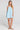 Front view of a woman wearing the Saltwater Luxe Lukas Mini Dress on a neutral background