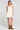 Front view of a woman wearing the Saltwater Luxe Lukas Mini Dress on a neutral background
