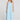Front view of a woman wearing the Saltwater Luxe Marcelia Azure Blue Midi Dress on a neutral background