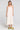 Front view of a woman wearing the Saltwater Luxe Marcelia Salt on a neutral background